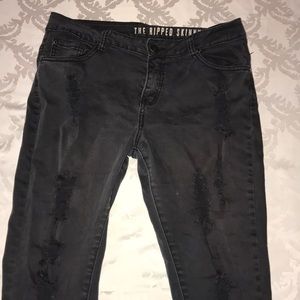 Ripped faded black skinny jeans